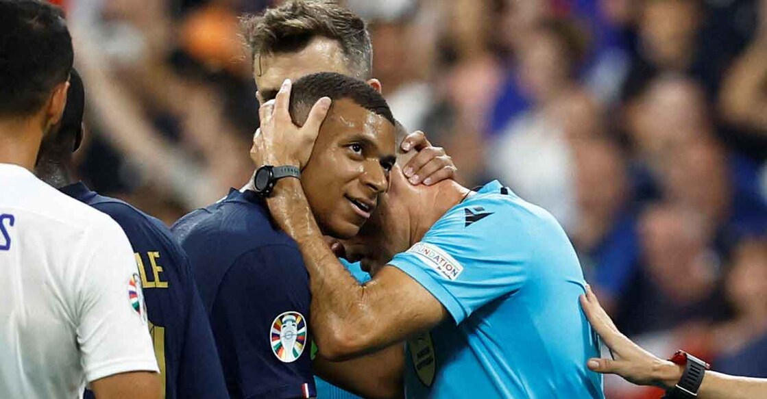 France's Kylian Mbappe with referee Antonio Mateu Lahoz after the match. Photo: Reuters/Gonzalo Fuentes