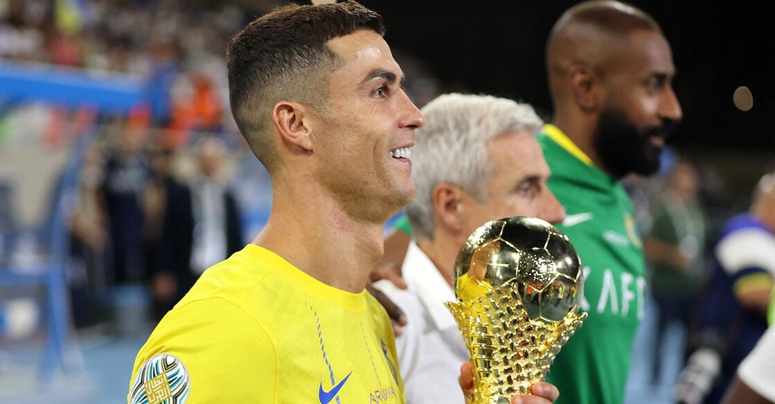 Al-Nassr's Cristiano Ronaldo celebrates with the trophy. Photo: Reuters/Stringer