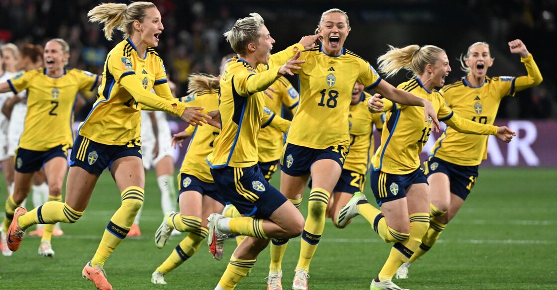 Swedish players celebrate their win. Photo: AFP/William West