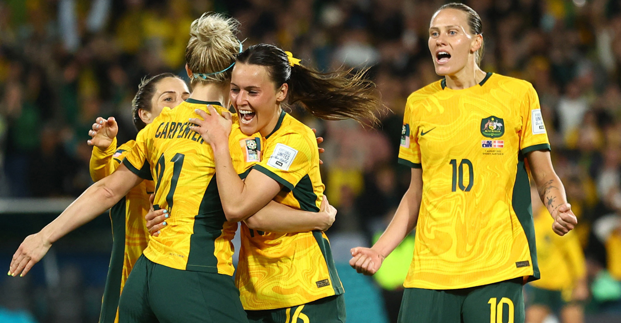 SOCCER-WORLDCUP-AUS-DNK-REPORT Australia's Hayley Raso celebrates scoring their second goal with Ellie Carpenter and Emily van Egmond. Photo: Reuters/Carl Recine