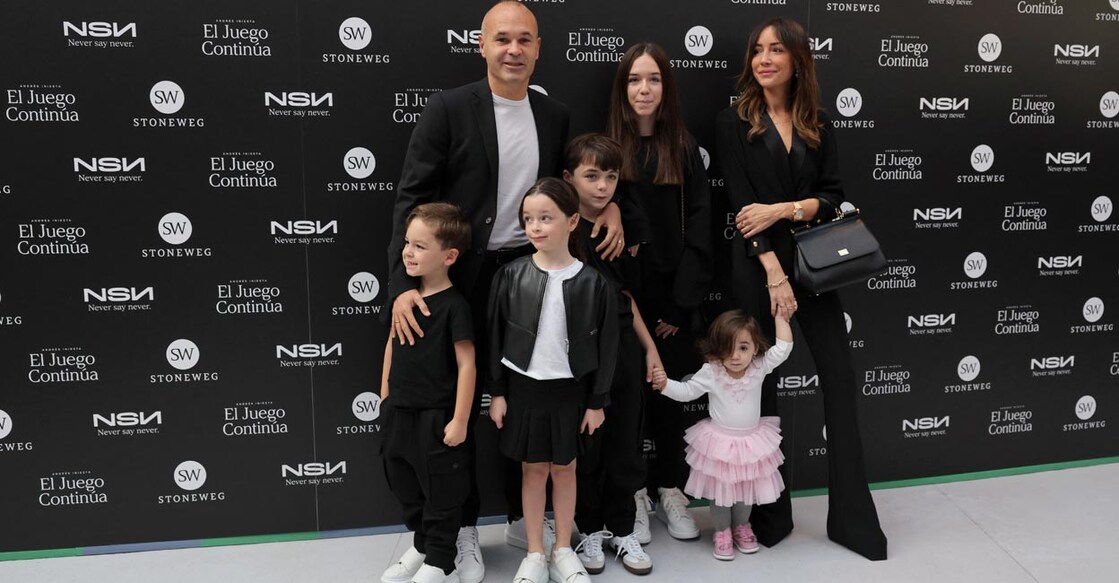 Andres Iniesta, his wife Anna Ortiz and their five children pose for photographs during an event in Barcelona. Photo: AFP/Lluis Gene