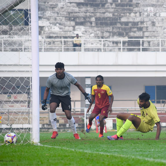 Muhammed Ashiq (green) of Railways gets a goal against Pondicherry in Group H qualifiers of the Santosh Trophy at the EMS Corporation Stadium in Kozhikode on Friday. Photo: Special arrangement