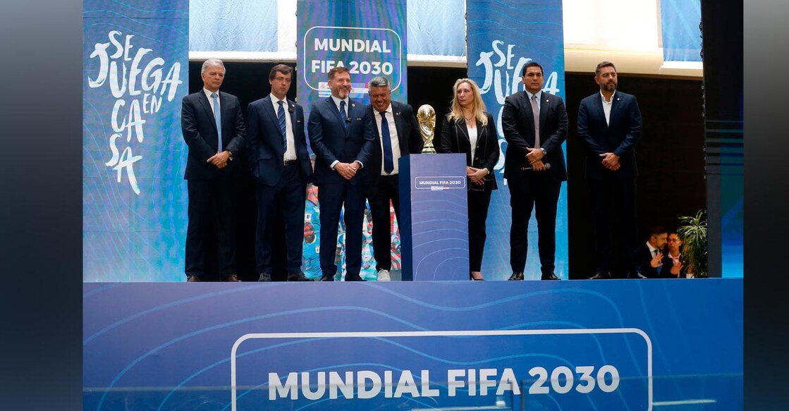 CONMEBOL ratifies the hosting of the 2030 World Cup opening matches in South America - Asuncion, Paraguay - December 11, 2024 CONMEBOL president Alejandro Dominguez, Uruguayan Football Association president Ignacio Alonso, Argentine Football Association president Claudio Tapia, Paraguayan Football Association president Robert Harrison, Argentina General Secretary of the Presidency Karina Milei, Paraguay vice president Pedro Alliana and Uruguay Sport minister Sebastian Bauza posing with a replica of the World Cup during the announcement REUTERS/Cesar Olmedo