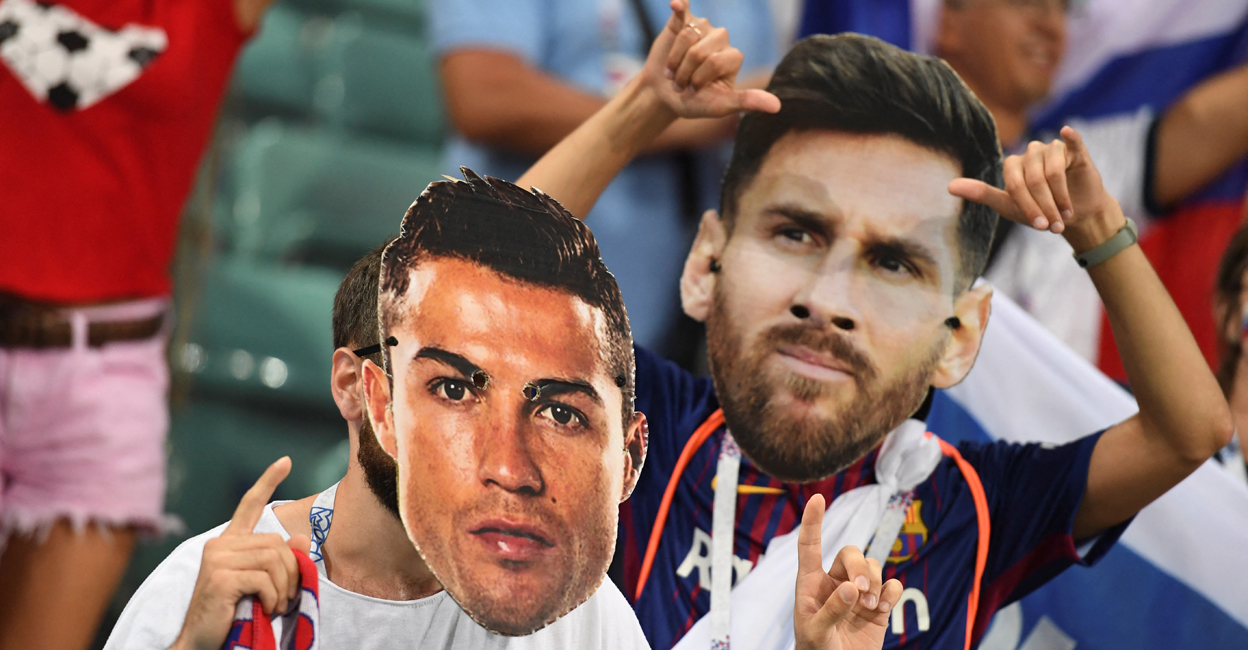 Football fans wearing masks depicting Portugal's forward Cristiano Ronaldo and Argentina's forward Lionel Messi pose before the Russia 2018 World Cup quarterfinal match between Russia and Croatia at the Fisht Stadium in Sochi on July 7, 2018. File photo: AFP/ Kirill Kudryavtsev