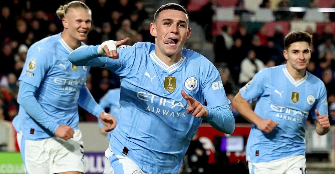 Manchester City's Phil Foden, centre, celebrates with Erling Haaland and Julian Alvarez after scoring his second goal. Photo: Reuters/David Klein