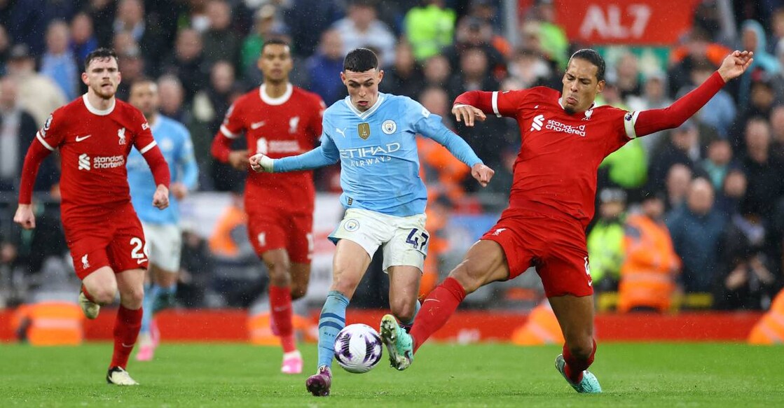 Liverpool's Virgil van Dijk in action with Manchester City's Phil Foden. Photo: Reuters