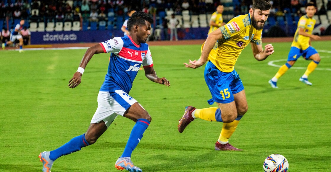 Bengaluru FC's Sivasakthi (blue) and Kerala Blasters' Milos Drincic vie for the ball during the ISL match in Bengaluru on Saturday. Photo: ISL