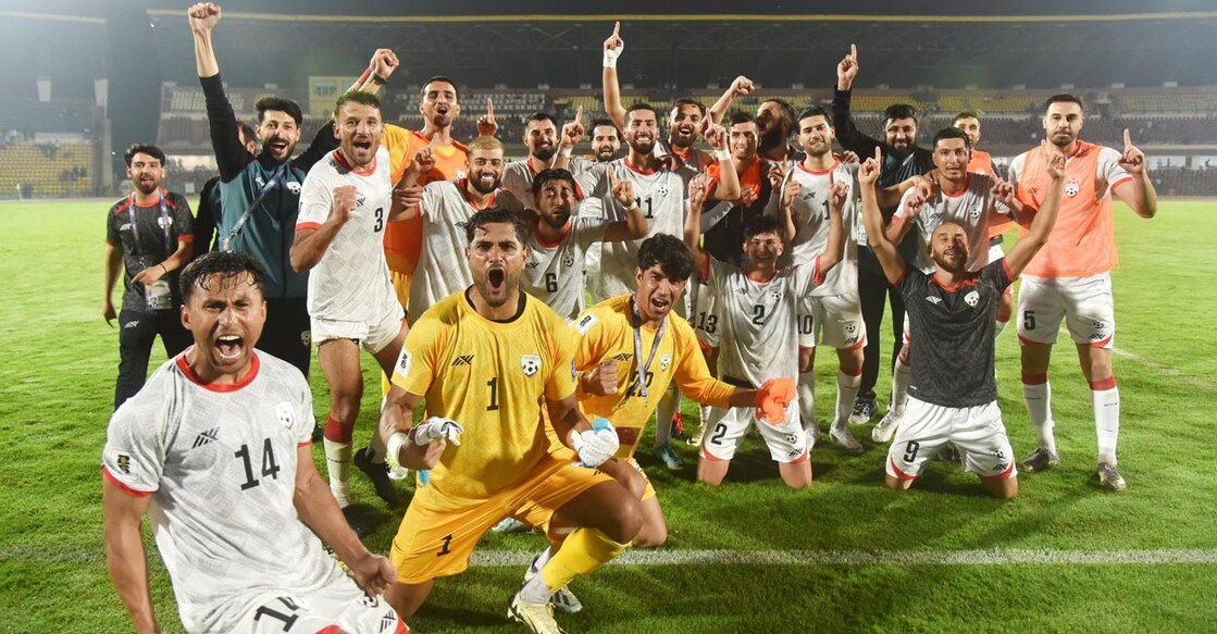 Afghan players celebrate their upset win. Photo: PTI
