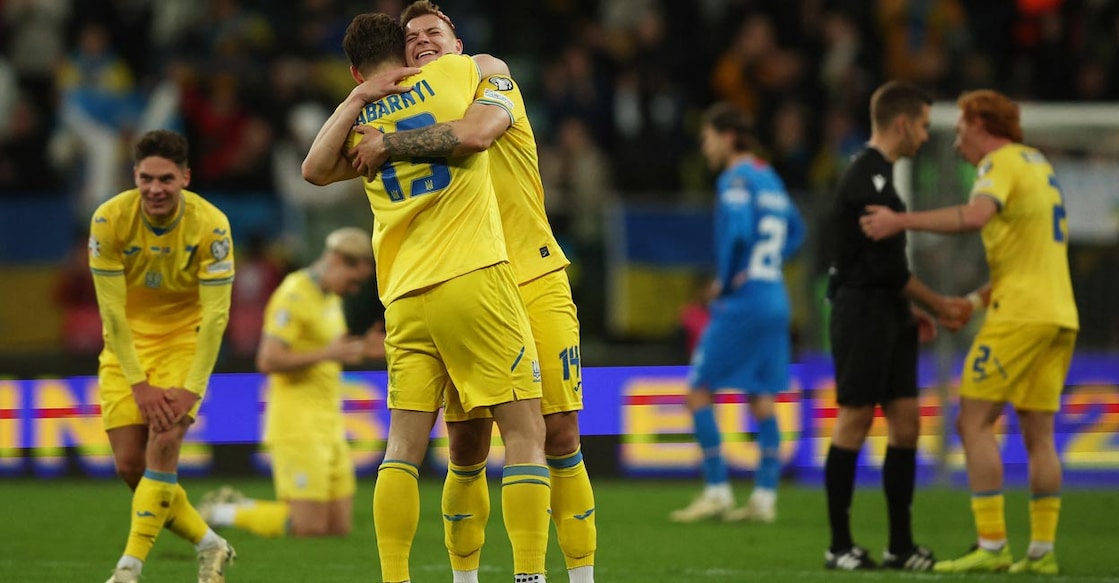 Ukraine's Illia Zabarnyi and Volodymyr Brazhko celebrate after qualifying for Euro 2024. Photo: Reuters/Kacper Pempel
