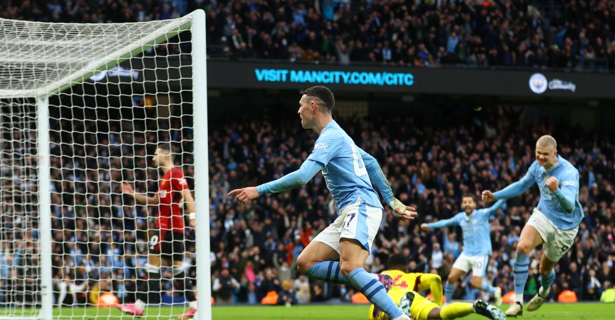 manchester-foden-c Manchester City's Phil Foden celebrates scoring their second goal with Erling Braut Haaland. Photo: Reuters