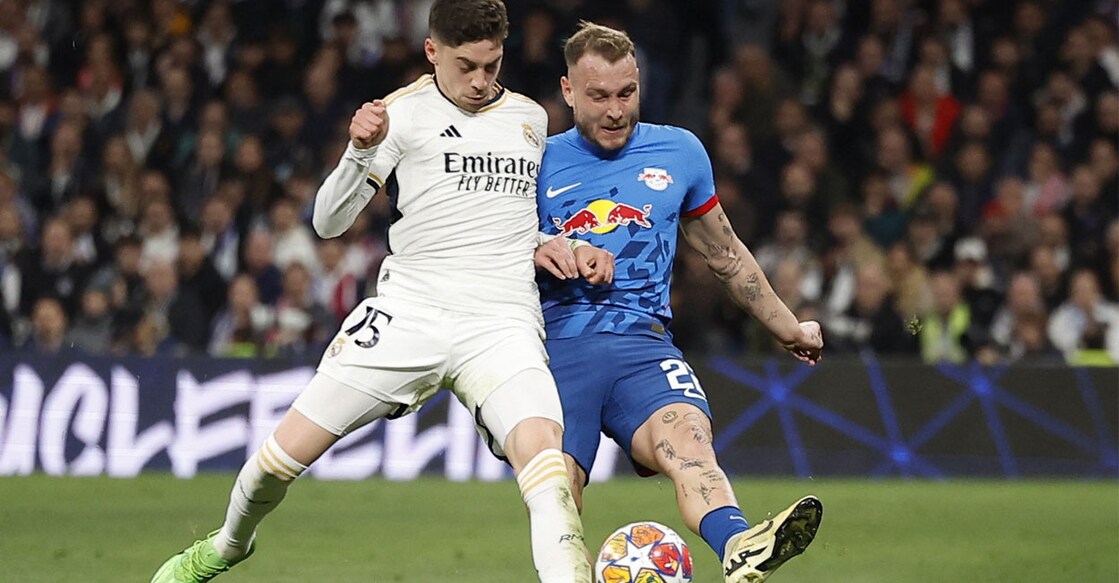 Real Madrid's Federico Valverde in action with RB Leipzig's David Raum
