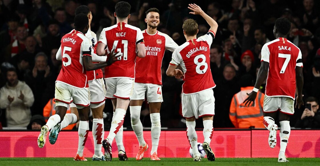 Arsenal players cerebrate scoring their second goal. Photo: Reuters/Dylan Martinez