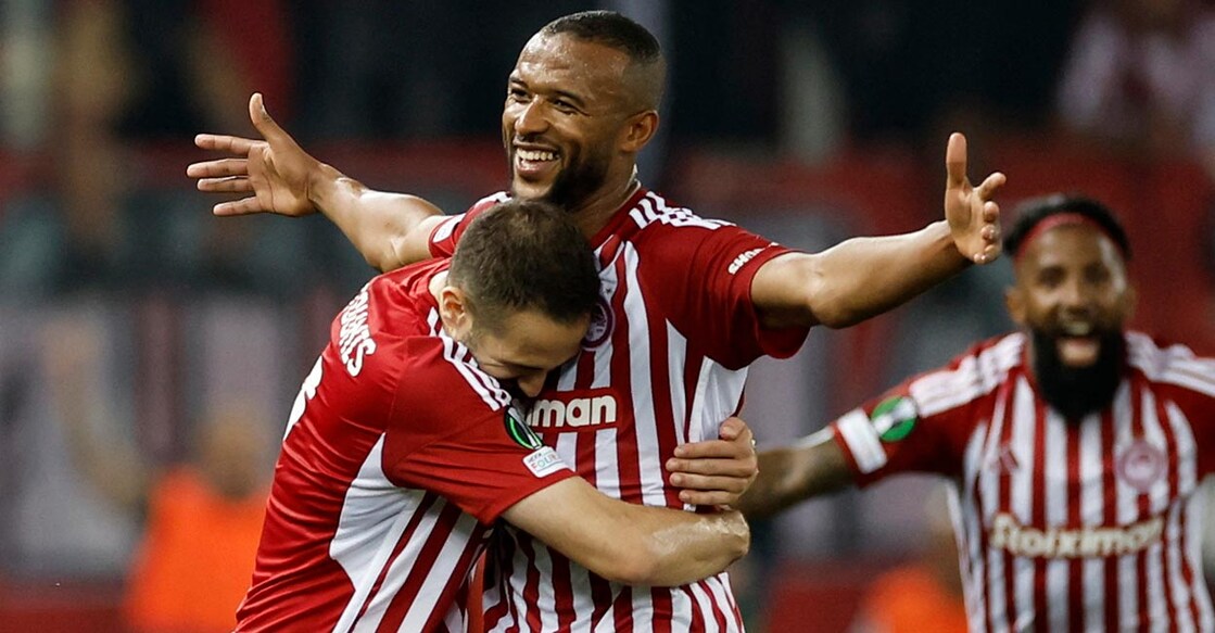 Olympiacos' Ayoub El Kaabi celebrates with Kostas Fortounis after scoring their second goal. Photo: Reuters/Louisa Gouliamaki