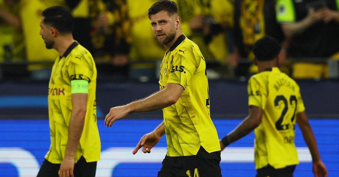 Borussia Dortmund's Niclas Fullkrug, centre, celebrates scoring their first goal. Photo: Reuters/Thilo Schmuelgen