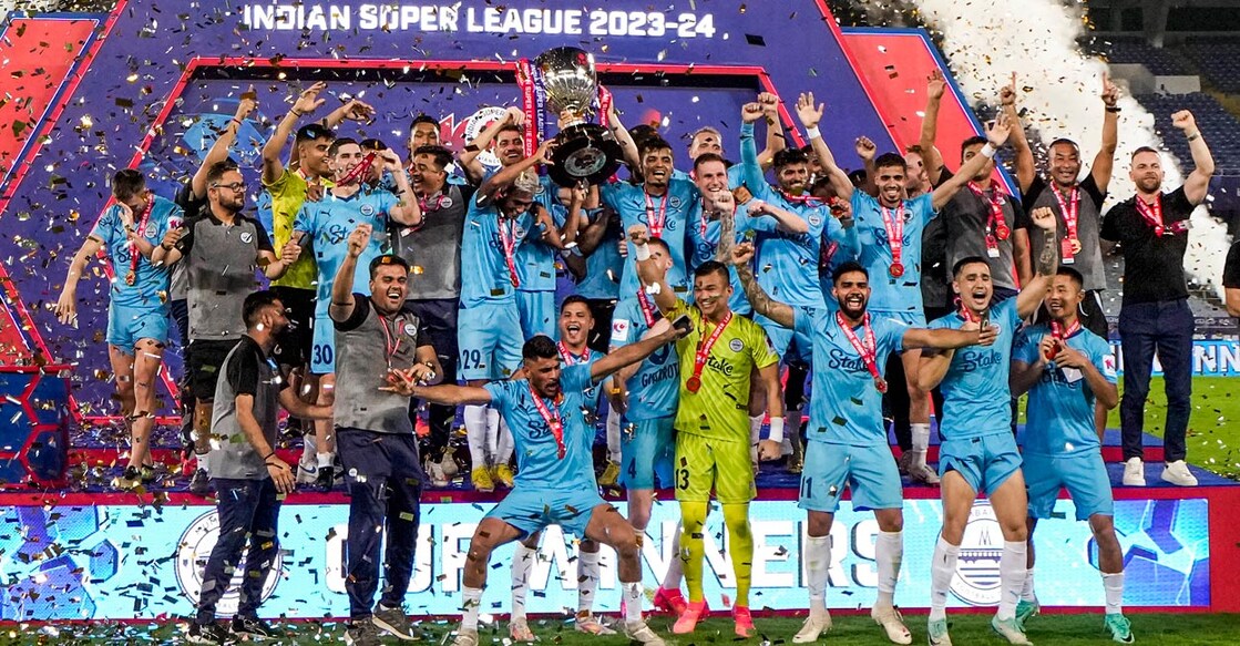 Mumbai City FC players celebrate with the ISL trophy. Photo: PTI/Swapan Mahapatra