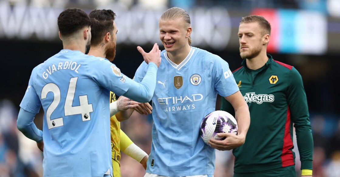 Manchester City's Erling Haaland, second right, celebrates with teammates after scoring a hat-trick in the first half. Photo: AFP/Darren Staples
