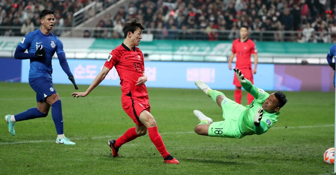 Singapore goalkeeper Hassan Sunny thwarts South Korea's Lee Jae-Sung. File photo: Reuters/Kim Soo-Hyeon