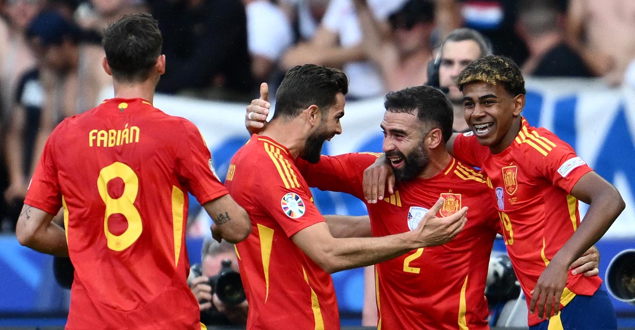 Spain's Dani Carvajal, second right, celebrates with teammates after scoring his team's third goal. Photo: AFP/Christophe Simon