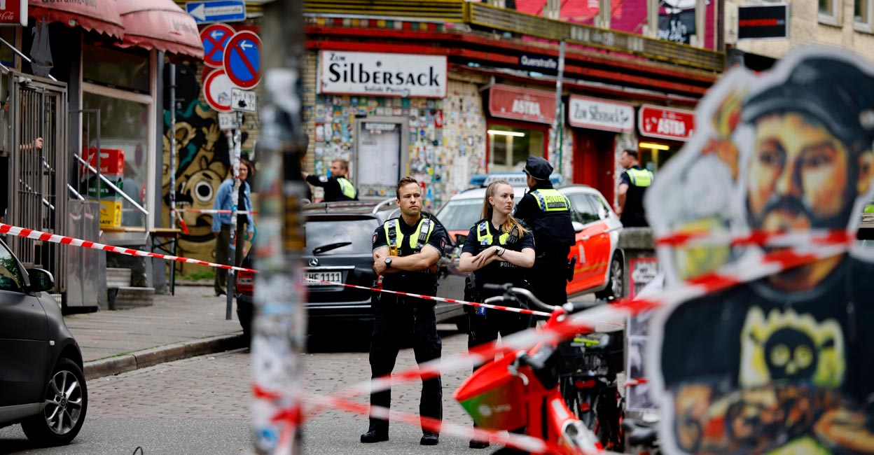 Police officers guard a cordoned off area at the St Pauli district of Hamburg. Photo: Reuters/Axel Schmidt