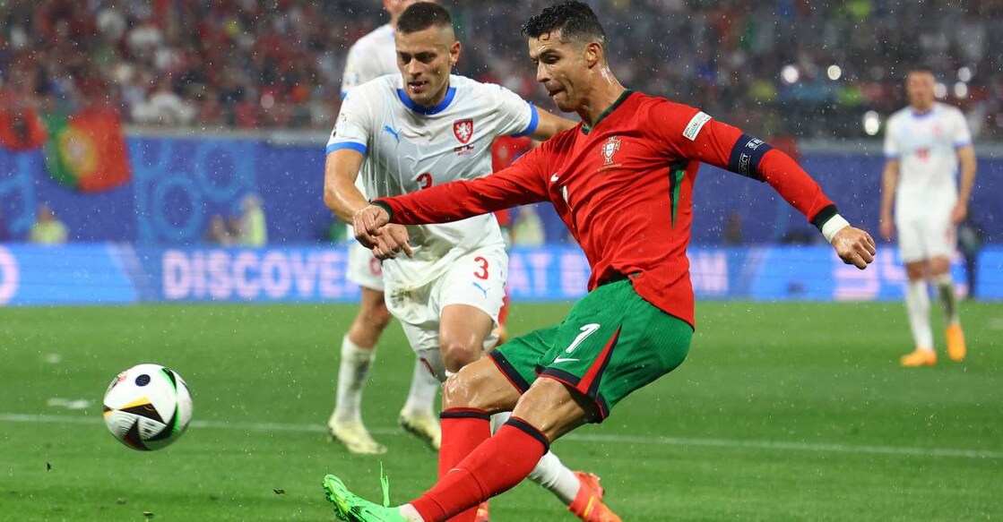 Portugal's Cristiano Ronaldo in action with Czech Republic's Tomas Holes. Photo: Reuters