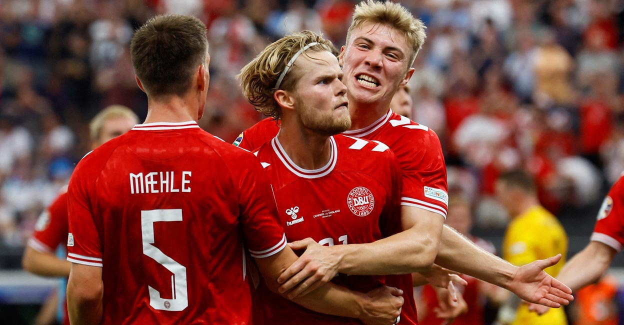 Denmark Denmark's Morten Hjulmand celebrates with teammates after scoring the equaliser. Photo: Reuters/Wolfgang Rattay