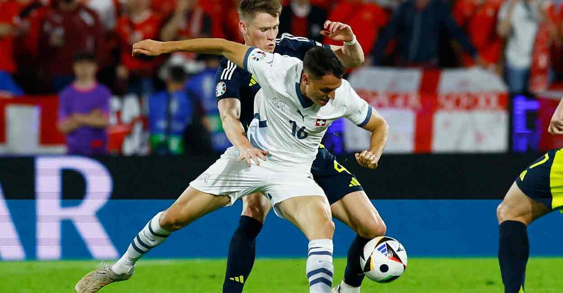  Scotland's Scott McTominay in action with Switzerland's Vincent Sierro. Photo: REUTERS/Piroschka Van De Wouw