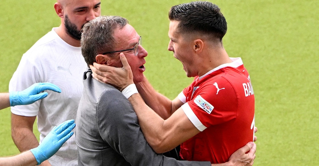 Austria's Christoph Baumgartner celebrates scoring their second goal with coach Ralf Rangnick. Photo: Reuters/Fabrizio Bensch