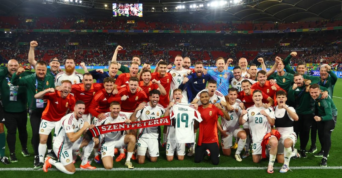 Hungary players celebrate after the match and hold up a shirt with Barnabas Varga's name after he was stretchered off during the match. Photo: Reuters/ Leonhard Simon