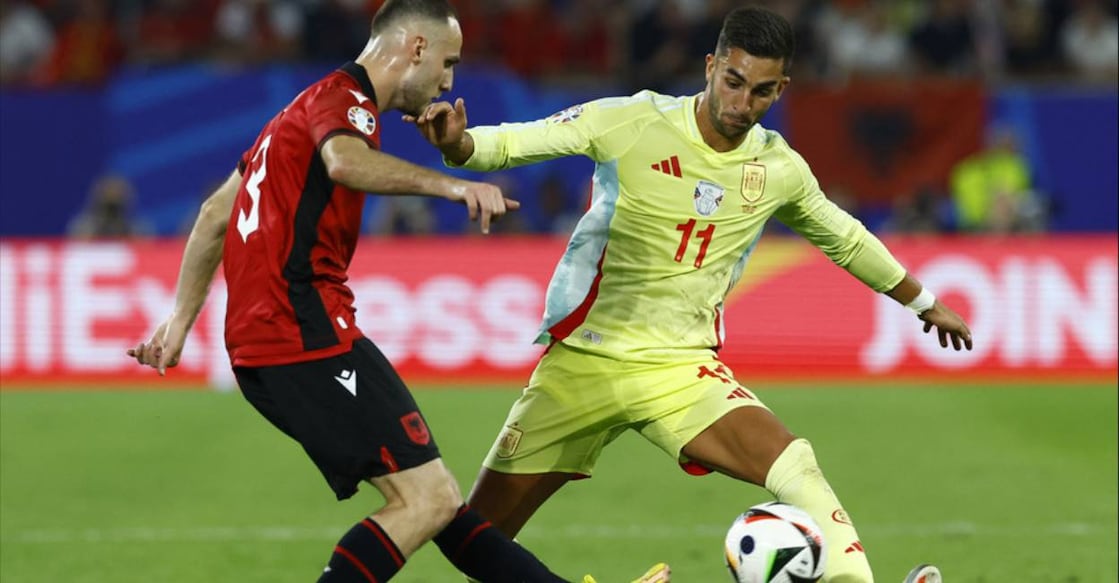 Spain's Ferran Torres in action with Albania's Mario Mitaj. Photo: Reuters/Piroschka Van De Wouw