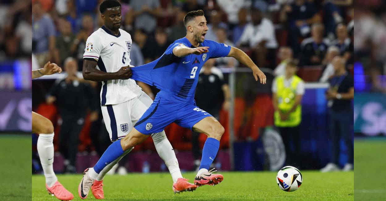 England's Marc Guehi fouls Slovenia's Andraz Sporar before being shown a yellow card. Photo: Reuters/ Andrew Couldridge