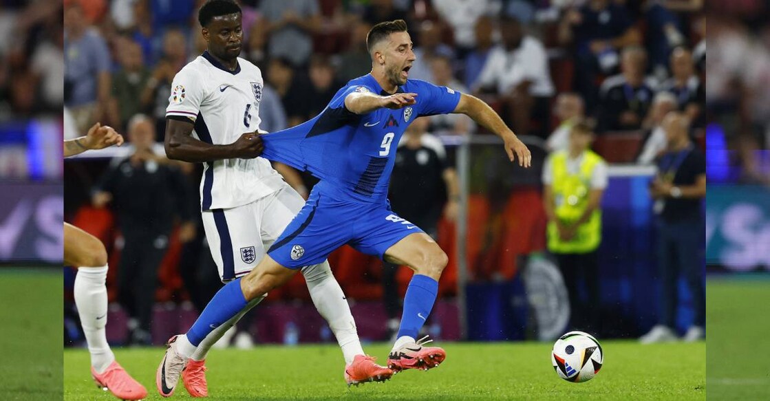England's Marc Guehi fouls Slovenia's Andraz Sporar before being shown a yellow card. Photo: Reuters/ Andrew Couldridge