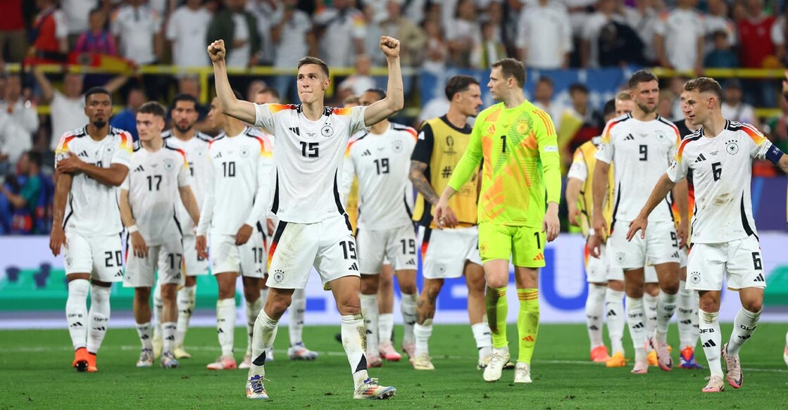 German players celebrate after the match. Photo: Reuters/Kai Pfaffenbach