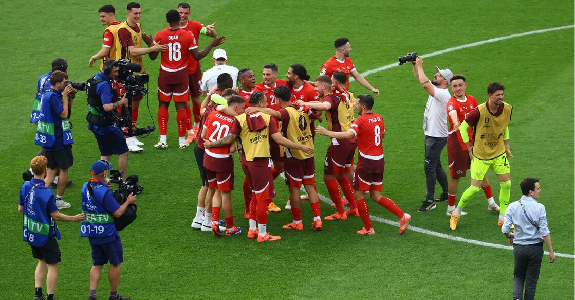 Switzerland players celebrate after the match. Photo: Reuters/Lisi Niesner