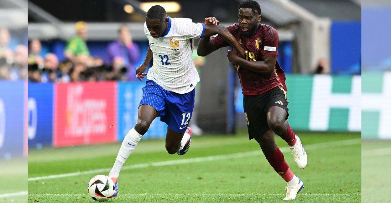 France's Randal Kolo Muani in action with Belgium's Orel Mangala. Photo: Reuters/Carmen Jaspersen

