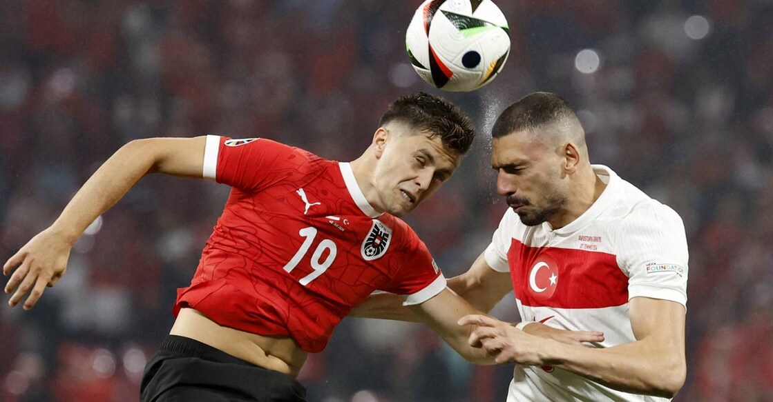Austria's Stefan Posch in action with Turkey's Ferdi Kadioglu. Photo: Reuters. 