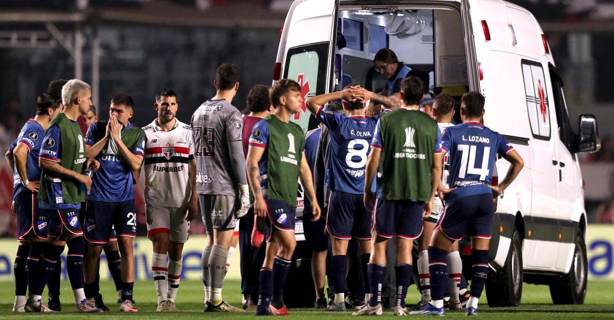Nacional's Juan Izquierdo is taken off after collapsing on the pitch. File photo: Reuters/Carla Carniel