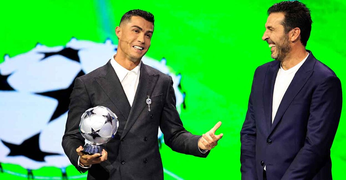 Cristiano Ronaldo, who is awarded the All-Time Goalscorer Award in the UEFA Champions League (left) with former goalkeeper Gianluigi Buffon on stage during the ceremony of the draw for the group stage of the 2024-2025 UEFA Champions League football tournament, at the Grimaldi Forum in Monaco on August 29, 2024. Photo: AFP/ Valery Hache
