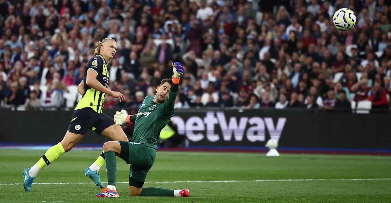 FBL-ENG-PR-WEST HAM-MAN CITY Manchester City's Erling Haaland scores his third goal past West Ham United's goalkeeper Lukasz Fabianski during the Premier League match at the London Stadium on August 31, 2024. Photo: AFP/ Henry Nicholls