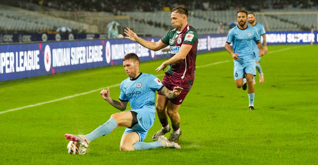 Players of Mohun Bagan Super Giant and Mumbai City vie for the ball during the ISL season opener at YBVK Stadium in Kolkata on Friday. Photo: PTI