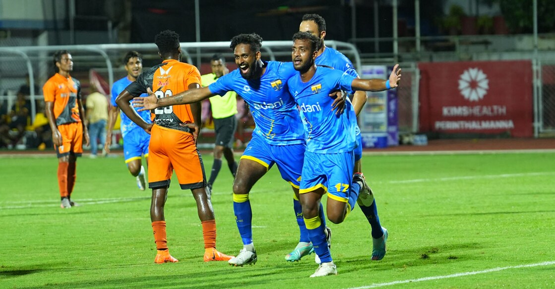 Vishnu TM (right) celebrates with his teammates after scoring Thiruvananthapuram Kombans' opener against Thrissur Magic in Thiruvananthapuram on Monday. Photo: Special arrangement