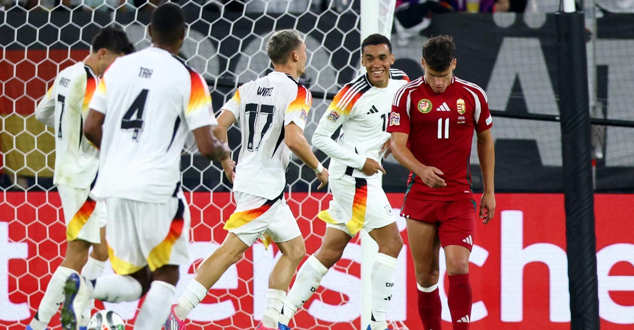 German players celebrate a goal. Photo: Reuters/Thilo Schmuelgen