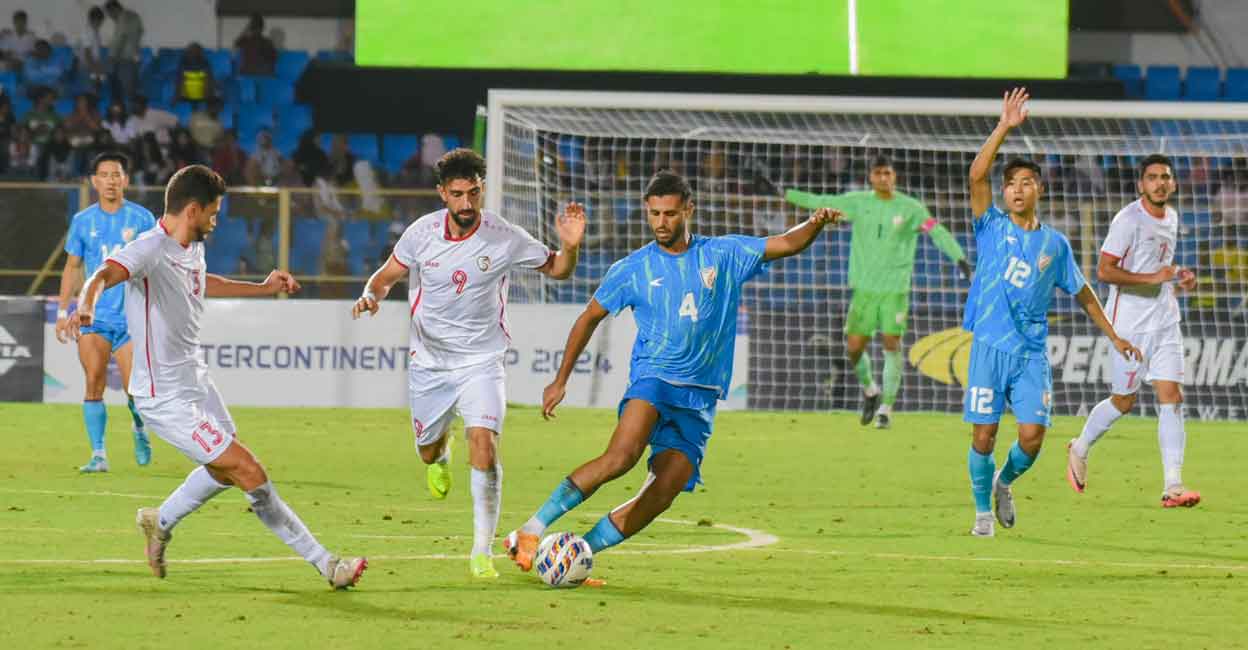 Indian (blue) and Syrian players in action during the Intercontinental Cup 2024 football match at GMC Balayogi Stadium in Hyderabad on Monday. Photo: PTI