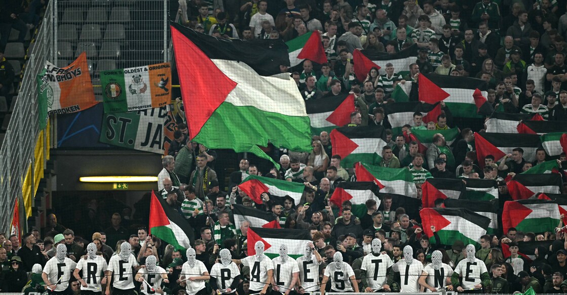 In this file photo from October 1, 2024, Celtics supporters hold Palestinian flags and stage a protest with the slogan 'Free Palestine' during the UEFA Champions League football match between Borussia Dortmund and Celtic in Dortmund. File photo: AFP/ Ina Fassbender