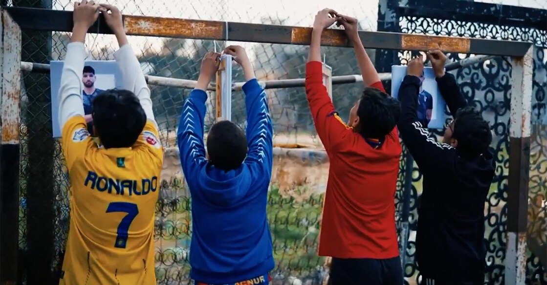 A screengrab from a video released by Palestine Football Association show boys display the roster of Palestine men’s football team.