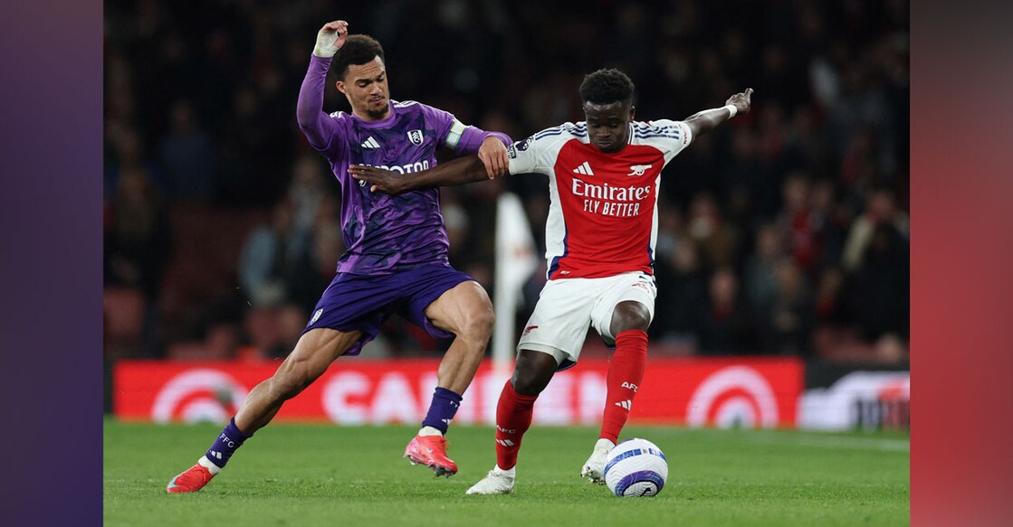 Fulham's Antonee Robinson in action with Arsenal's Bukayo Saka. Photo: Reuters/John Sibley