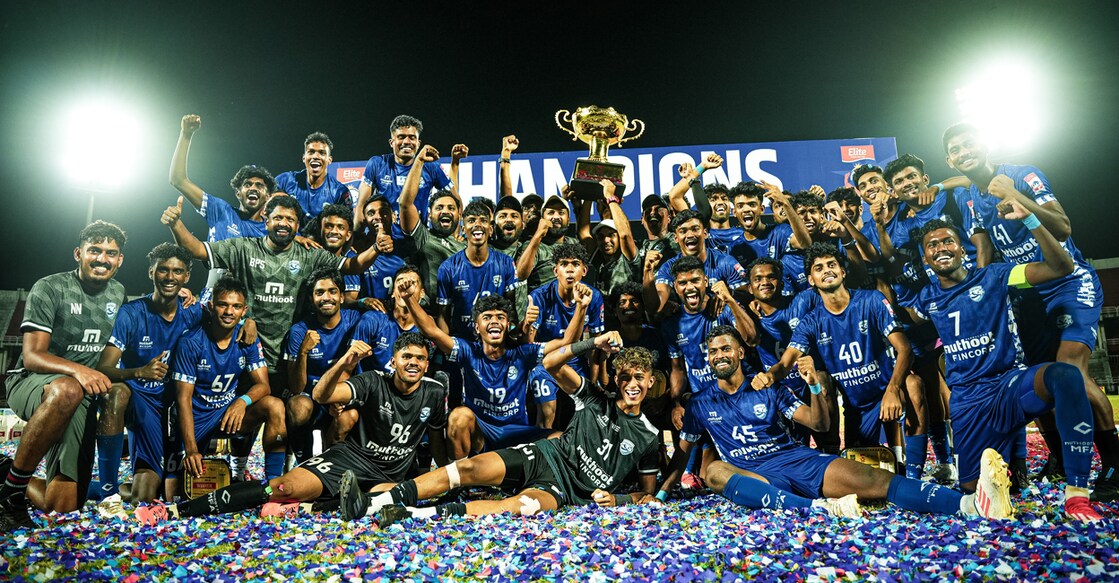 Muthoot FA players celebrate with the trophy after being crowned Kerala Premier League champions in Kozhikode on May 11, 2025. Photo: KFA