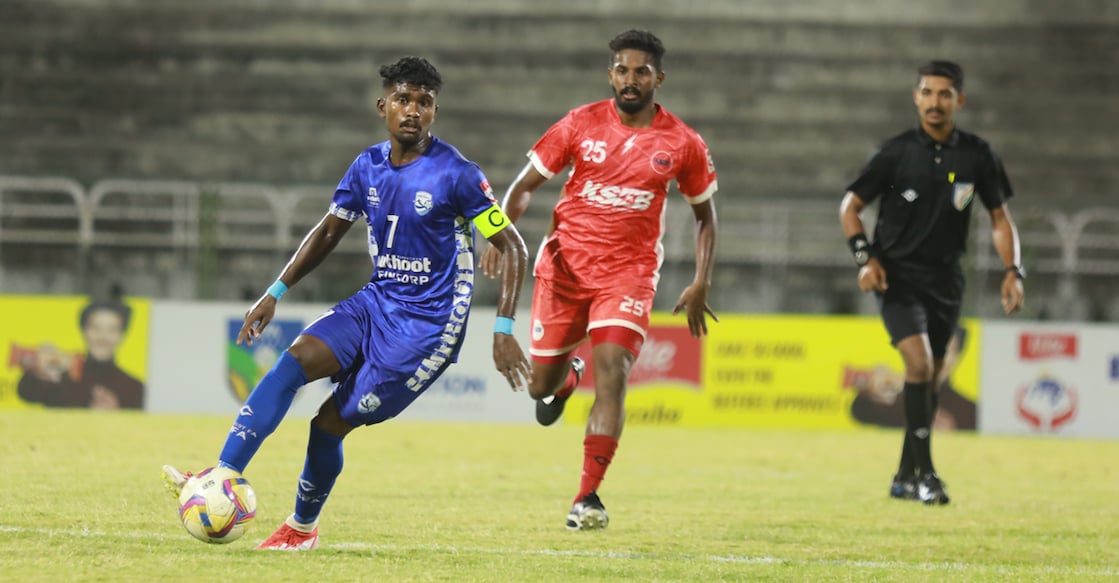 muthoot-fa-kpl-semi Ajay Krishnan (blue) of Muthoot FA in action against KSEB during the first semifinal of Kerala Premier League at the EMS Corporation Stadium in Kozhikode on May 7, 2025. Photo: KFA