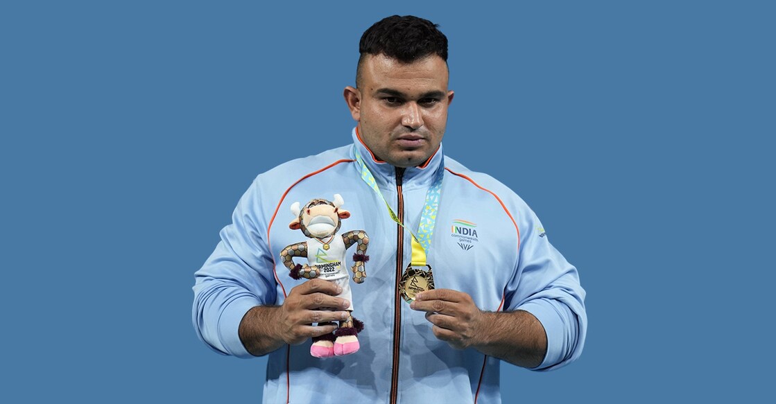 Sudhir Singh poses with the gold medal. Photo: IANS