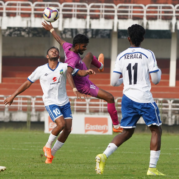 Action between Kerala (white) and Railways in the Santosh Trophy Group H qualifiers at the EMS Corporation Stadium in Kozhikode on Wednesday. Photo: Special arrangement