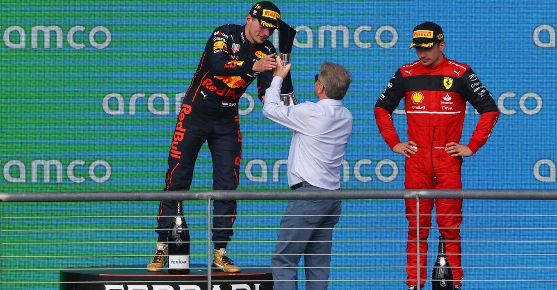 Red Bull's Max Verstappen celebrates on the podium after winning the United States Grand Prix with third placed Ferrari's Charles Leclerc. Photo: Reuters/Mike Segar.